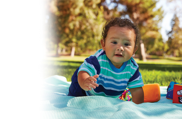 baby sitting on blanket