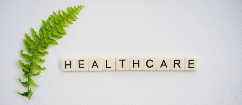 Healthcare spelled with scrabble tiles Healthcare spelled with scrabble tiles