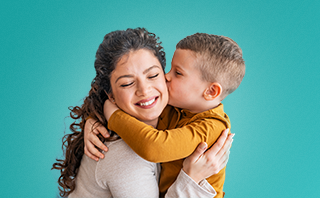 woman with child kissing cheek
