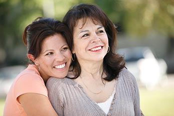 Daughter hugging mother